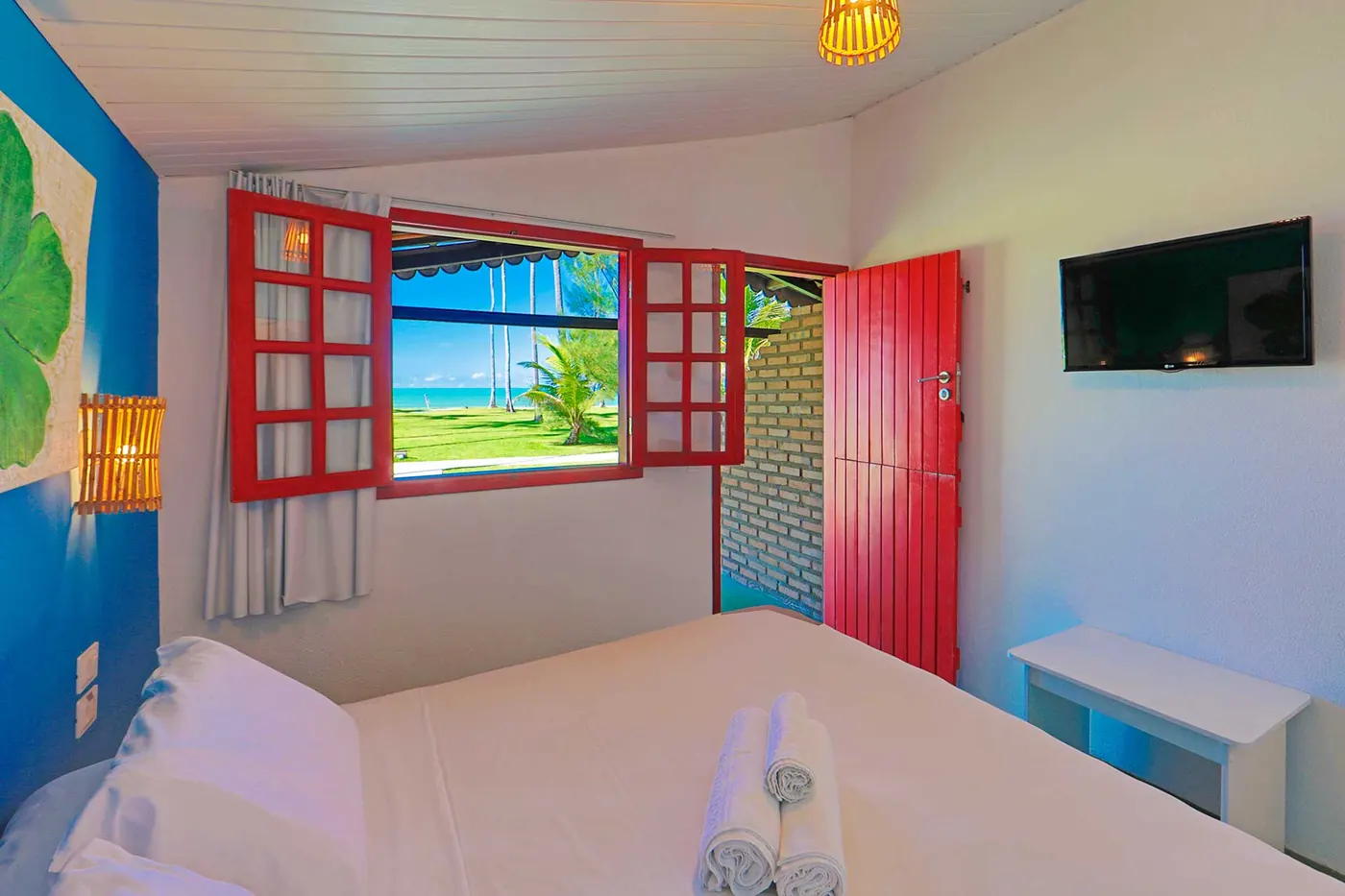 Duplo Econômico Vista Mar — quarto com janela aberta para o mar